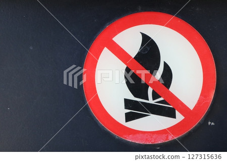 Warning Sign Indicating the Prohibition of Open Flames in Public Spaces and Environments Warning Sign Indicating the Prohibition of Open Flames in Public Spaces and Environments 127315636