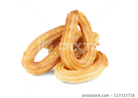 Heap of traditional spanish dessert churros, fried dough pastry isolated on white background 127315716