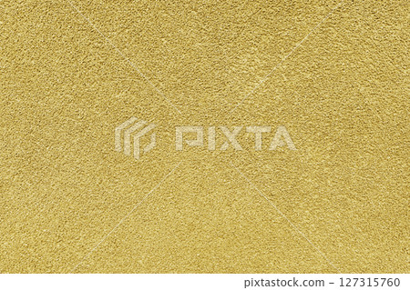 Grainy texture of yellow colored asphalt, plaster, cement, plastic close up, macro background 127315760