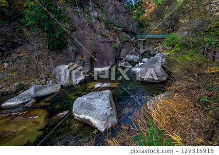 Autumn scenery of the valley and clear stream with floating rocks at Shosenkyo Gorge, Yamanashi Prefecture Autumn scenery of the valley and clear stream with floating rocks at Shosenkyo Gorge, Yamanashi Prefecture 127315918