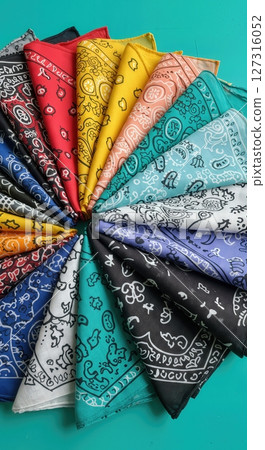 Vibrant Multicolor Paisley Bandana Collection Arranged in Fan Shape on Turquoise Background, Classic Cotton Kerchiefs in Assorted Colors for Fashion, Crafts, and Western Decor 127316052