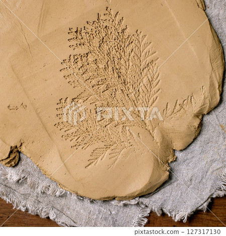 Decorating of raw clay ceramics Decorating of raw clay ceramics 127317130
