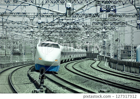 The 100 series V-formation Grand Hikari Shinkansen train passes through Hamazu Station The 100 series V-formation Grand Hikari Shinkansen train passes through Hamazu Station 127317312