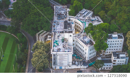 June 10 2025 View of Circular Building Surrounded by Greenery and Sports Field June 10 2025 View of Circular Building Surrounded by Greenery and Sports Field 127318090
