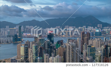 June 10 2025 Urban Skyline View with Sea and Mountains at Dusk June 10 2025 Urban Skyline View with Sea and Mountains at Dusk 127318126