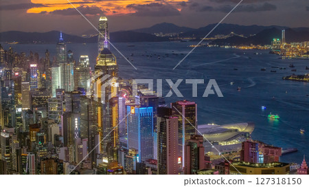 June 10 2025 Hong Kong Cityscape at Twilight with Illuminated Skyscrapers and Harbor Views 127318150