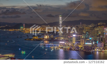 June 10 2025 Nighttime View of Densely Lit Urban Skyline and Waterfront Harbor 127318162