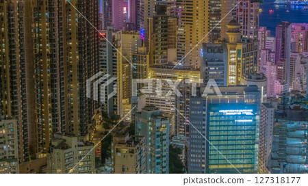 June 10 2025 Illuminated Cityscape with Modern Skyscrapers and Waterfront at Night 127318177