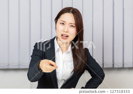 Angry Asian woman in a suit 02 127318333