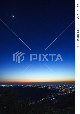 The rice fields of the Tedori River alluvial fan and the Sea of Japan as seen from the Saikaku Forest Road in the setting sun The rice fields of the Tedori River alluvial fan and the Sea of Japan as seen from the Saikaku Forest Road in the setting sun 127318436