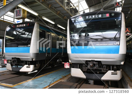 E233 series 1000 series Sai 103 and Sai 102 trains lined up at a train depot on the Keihin Tohoku Line E233 series 1000 series Sai 103 and Sai 102 trains lined up at a train depot on the Keihin Tohoku Line 127318560