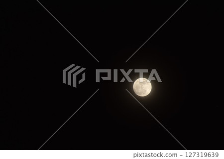 pink full moon covering by cloud floating on sky in night background pink full moon covering by cloud floating on sky in night background 127319639