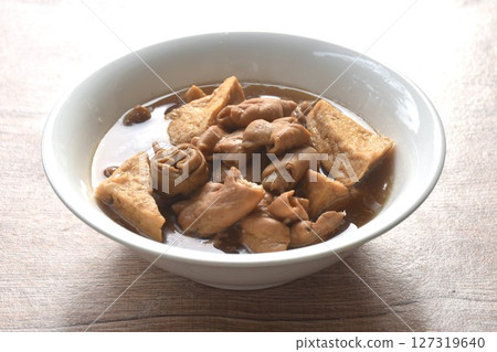 boiled braised slice pork innards and tofu in black Chinese herb soup on bowl boiled braised slice pork innards and tofu in black Chinese herb soup on bowl 127319640