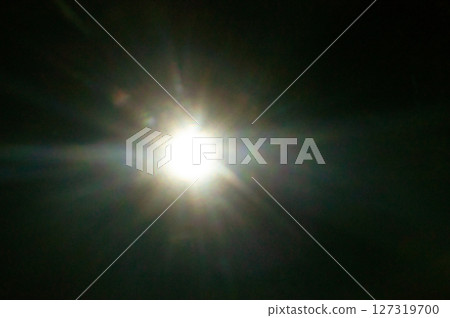 Sun flare on the black background Sun flare on the black background 127319700