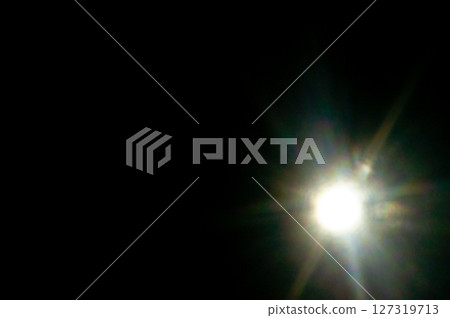 Sun flare on the black background Sun flare on the black background 127319713