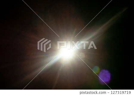 Sun flare on the black background Sun flare on the black background 127319719
