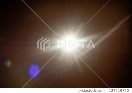 Sun flare on the black background 127319730