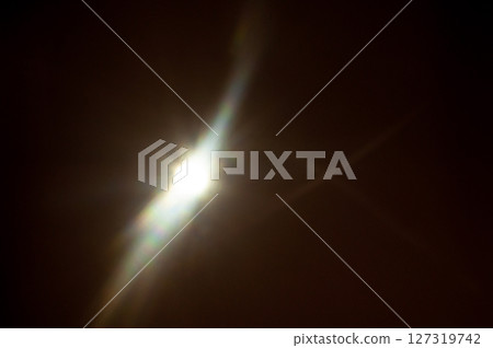 Sun flare on the black background 127319742