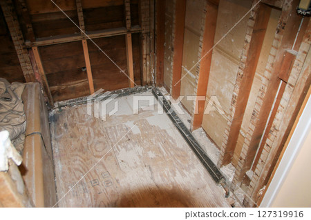 Renovation Uncovers Unfinished Room With Exposed Walls 127319916
