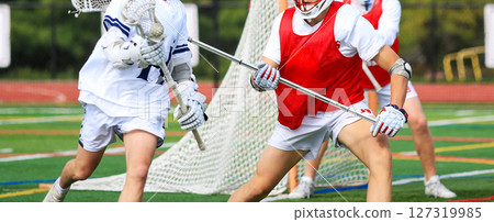 Young Athletes Compete in an Exciting Lacrosse Game close up 127319985