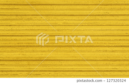 Bright yellow textured background creating horizontal lines with darker specks 127320324