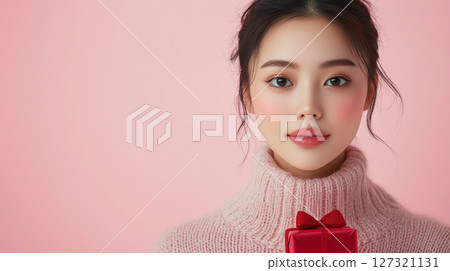 New Year, Christmas minimalist cosmetology banner with copy space, clean background, Asian woman, beauty industry New Year, Christmas minimalist cosmetology banner with copy space, clean background, Asian woman, beauty industry 127321131