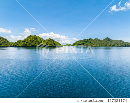 Seascape. Tropical sea water texture reflections like paradise summer vacation. Mindanao, Philippines. 127321174