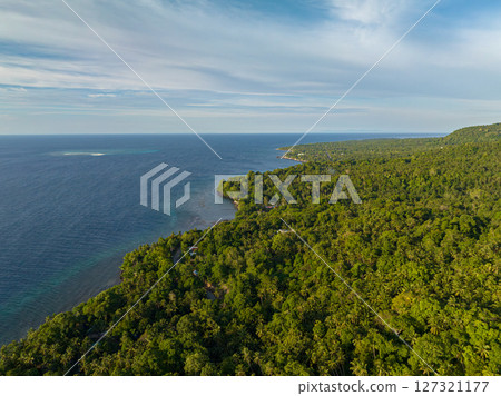 Camiguin Island with sandbar and deep blue water. Blue sky and clouds. Philippines. 127321177