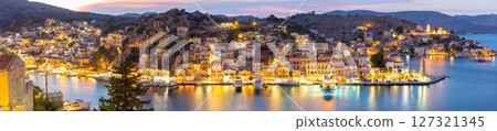 Symi harbor at dusk in Symi, Greece 127321345