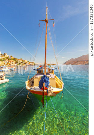 Fishing boat in harbor of Symi, Greece 127321346