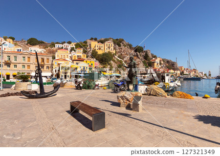 Harbor promenade in Symi, Greece 127321349