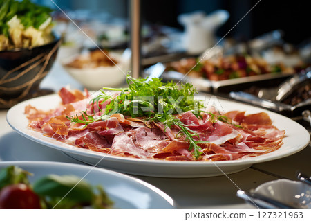 Side view of bacon served in a restaurant. Food and meat concept Side view of bacon served in a restaurant. Food and meat concept 127321963