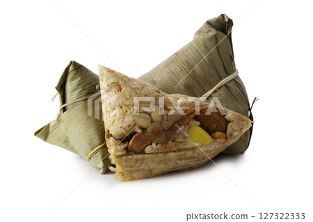 Zongzi or Bacang is a sticky rice dumpling wrapped in bamboo leaves, filled with savory or sweet ingredients, enjoyed during the Dragon Boat Festival. isolated on a white background Zongzi or Bacang is a sticky rice dumpling wrapped in bamboo leaves, filled with savory or sweet ingredients, enjoyed during the Dragon Boat Festival. isolated on a white background 127322333
