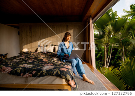 Remote Work in Tropical Bedroom Remote Work in Tropical Bedroom 127322796