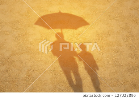 Insurance Conceptual Image of Child's Shadow Shaped Like an Umbrella on a Yellow Background Insurance Conceptual Image of Child's Shadow Shaped Like an Umbrella on a Yellow Background 127322896