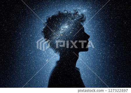 Silhouette of a Human Head Filled with Swirling Galaxies and Stars Against a Dark Background Silhouette of a Human Head Filled with Swirling Galaxies and Stars Against a Dark Background 127322897
