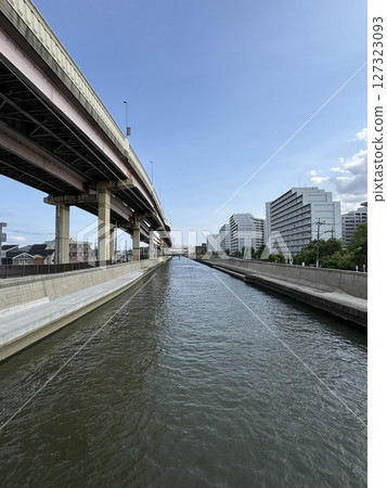 The elevated Metropolitan Expressway Route 6 Misato Line lined up next to the Ayase River in Adachi Ward, Tokyo 127323093