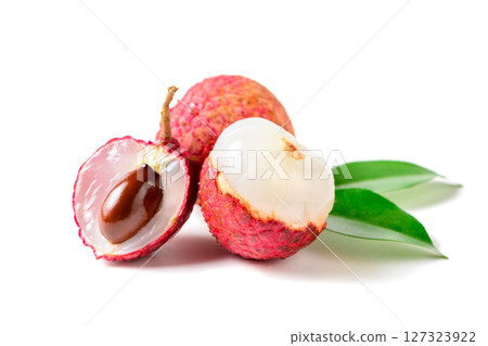 Three Juicy Lychee with cut in half and leaves isolated on white background. 127323922