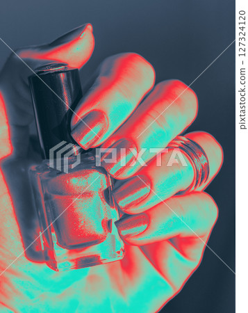 Infrared Thermal Image of Nail Polish on Well-Groomed Nails with nail polish bottle in hand. Close up Infrared Thermal Image o female hand with manicure and Nail lacquer bottle in fingers. Nail Polish Infrared Thermal Image of Nail Polish on Well-Groomed Nails with nail polish bottle in hand. Close up Infrared Thermal Image o female hand with manicure and Nail lacquer bottle in fingers. Nail Polish 127324120