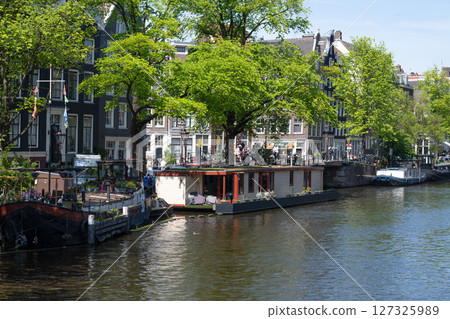 Scenery along the canal in Amsterdam/Netherlands Scenery along the canal in Amsterdam/Netherlands 127325989