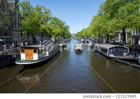 Scenery along the canal in Amsterdam/Netherlands Scenery along the canal in Amsterdam/Netherlands 127325995