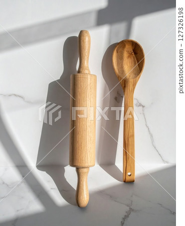 Wooden Rolling Pin and Spoon on Marble Surface Wooden Rolling Pin and Spoon on Marble Surface 127326198