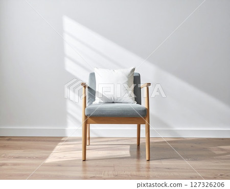 Grey Armchair with White Cushion in Sunlit Room 127326206