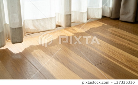 Sunlight on Warm Brown Hardwood Floor Near Curtains Sunlight on Warm Brown Hardwood Floor Near Curtains 127326330