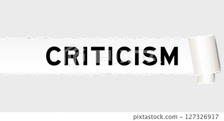 Ripped gray paper background that have word criticism under torn part 127326917