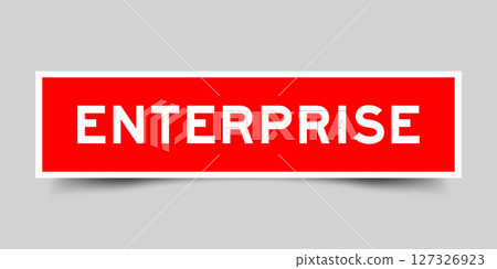 Red color square label sticker with word enterprise that inserted in gray background 127326923