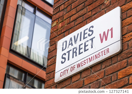 Davies Street W1 road sign on red brick wall in Mayfair, City of Westminster, London 127327141