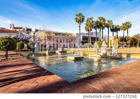 Silves, Portugal - Feb 21, 2025: Praca Al Mutamid Square with fountains and modern sculptures at Silves, Portugal 127327298