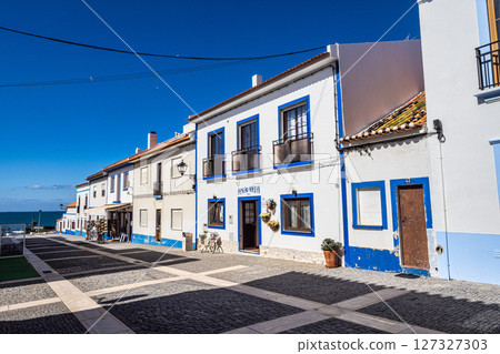 Porto Covo, Portugal - Feb 28, 2025: Traditional blue and white Alentejo Portuguese buildings in Porto Covo, Portugal 127327303