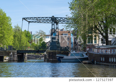 Amsterdam cityscape from a cruise ship, drawbridge, Netherlands Amsterdam cityscape from a cruise ship, drawbridge, Netherlands 127327397